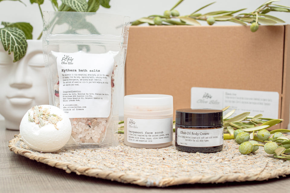 Olive Bliss Gift Set box, contains one body cream, one face scrub, one bath salts and one bath bomb